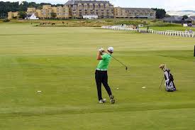 golfer hitting at scotland golf course